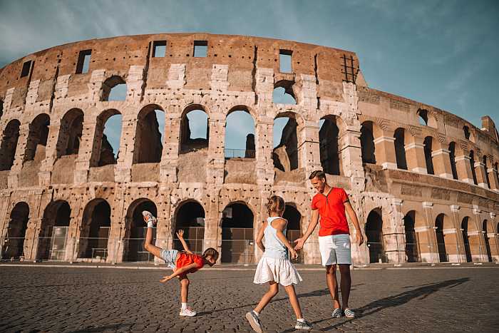 Family visiting the Colosseum in Rome during a multi-generational vacation