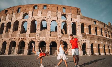 Family visiting the Colosseum in Rome during a multi-generational vacation