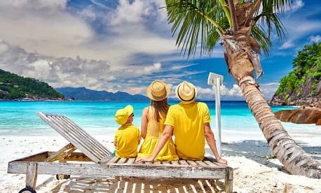 Family relaxing on a tropical beach during a Passover program vacation